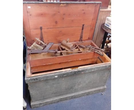 AN OLD PINE TOOL CHESTwith original worn painted finish 91cm wide, containing a few tools and odds and ends