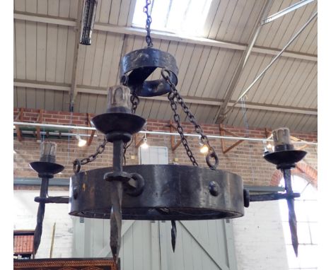 A WROUGHT IRON CHANDELIER, IN THE  MEDIEVAL STYLE65cm wide, approx 120cm long (with chain) (for re-wiring)
