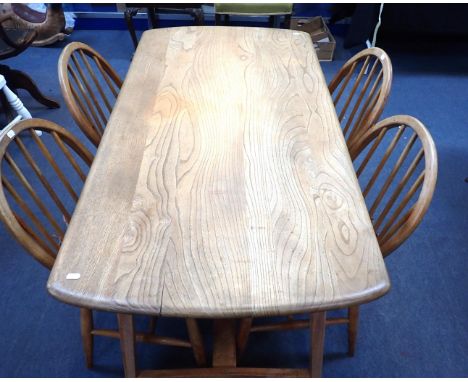 ERCOL: AN ELM AND BEECH DINING TABLE WITH 'H' STRETCHERlinking four angled tapering legs, 68 x 137cm (unmarked, small crack t
