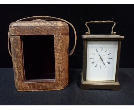 A MATTHEW NORMAN BRASS CARRIAGE CLOCKstriking on a coiled gong, movement numbered 1750A, 17cm high (handle up), in an associa