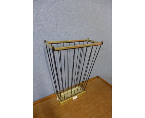 A mid 20th Century cast iron and brass stick stand 