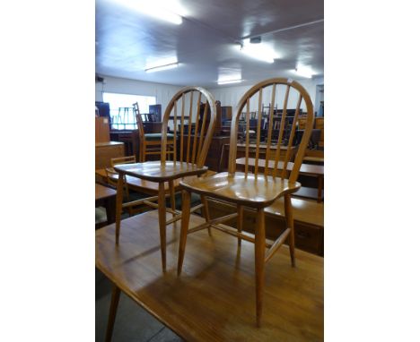 A pair of Ercol elm and beech Windsor chairs 