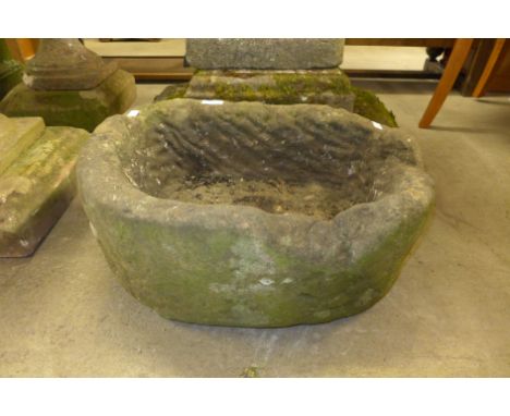 A sandstone D-shaped garden trough 