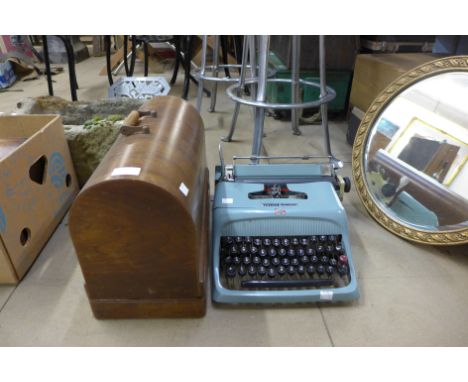 A Singer sewing machine and an Olivetti Studio 44 typewriter 