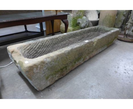 A large sandstone garden trough 