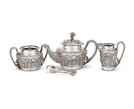 AN INDIAN SILVER FOUR PIECE TEA SERVICE UNMARKED, ATTRIBUTED TO P. ORR & SONS, MADRAS, LATE 19TH CENTURY The tea pot with a f