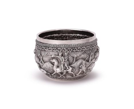 A BURMESE SILVER BOWL UNMARKED Chased with foliate bands and a hunting scene, the base engraved with a peacock 18cm (7in) dia