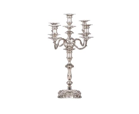 A LATE VICTORIAN SILVER FIVE LIGHT CANDELABRA HAWKSWORTH, EYRE & CO. LTD., SHEFFIELD 1895 The shaped square sconces and drip 