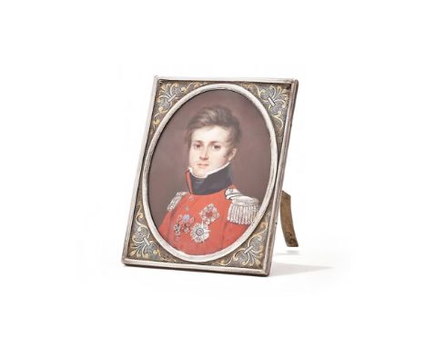 Y A PORTRAIT MINIATURE OF FREDERICK IV, PRINCE OF SALM-KYRBURG IN LATER SILVER FRAME  The oval miniature of the prince in red