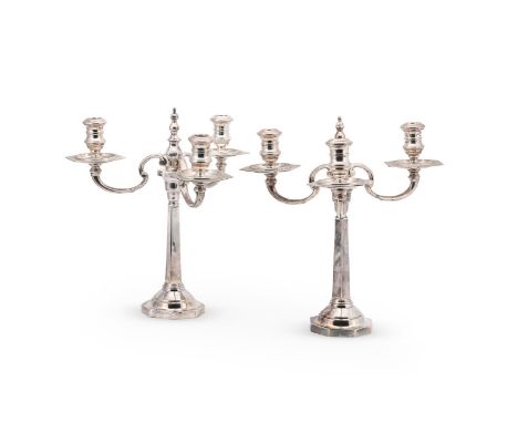A PAIR OF SILVER CANDLESTICKS WITH ASSOCIATED THREE LIGHT BRANCHES THE BASES TAITE & SONS, LONDON 1947, THE BRANCHES HARRODS 