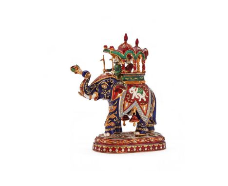 A GOLD COLOURED AND JAIPUR ENAMEL MODEL OF AN ELEPHANT UNMARKED, MODERN Carrying two figures in a Howdah, inset with diamonds
