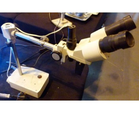 BINOCULAR MICROSCOPE. Binocular microscope in working order