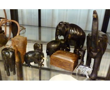 ELEPHANT FIGURES. Shelf of elephant figures including ebony examples