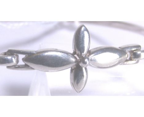 SILVER BANGLE. Solid silver flower design bangle