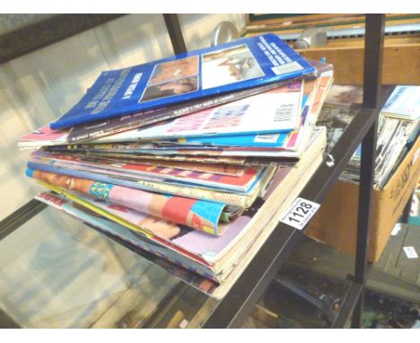 GLAMOUR MAGAZINES. Shelf of glamour magazines