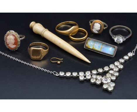 A quantity of gold rings; together with an opal and rock crystal brooch, bone needle case etc