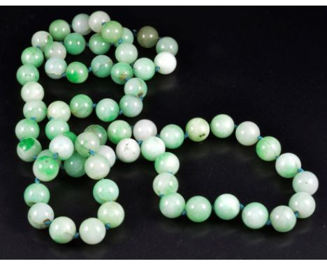A vintage jade bead necklace in apple green hues