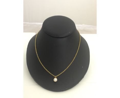 A 15ct chain and pearl pendant, c1900