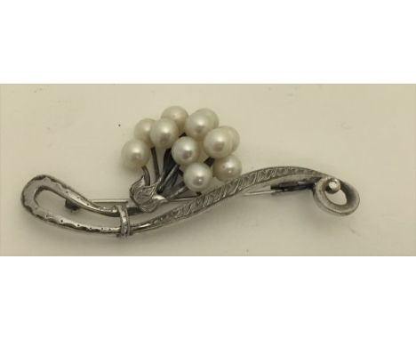 A vintage Mikimoto silver pearl brooch