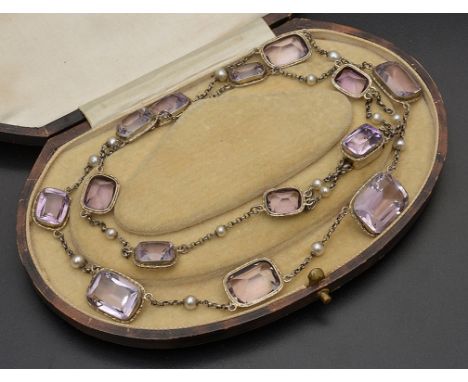 A silver, amethyst and pearl long necklace with graduated rectangular cut amethysts and pearl dividers to the chain