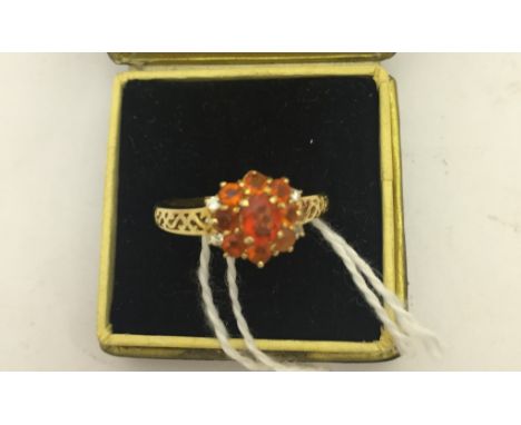 A 14k fire opal cluster ring