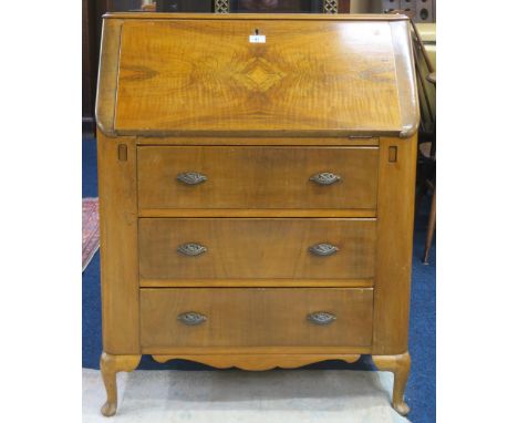 A 20th century walnut veneered writing bureau with fitted fall front writing compartment over three drawers on cabriole suppo