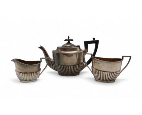 An Edwardian Bachelors silver tea service, by Walker &amp; Hall, Birmingham 1908, 559gms (3) Condition Report:Available upon 