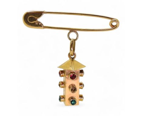 A bright yellow metal traffic light brooch, stamped 750, weight 5.6gms Condition Report:Available upon request