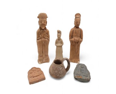 Three Chinese tomb pottery figures, one in the Sui dynasty style, a carved Buddhist statue, another in the Tang Dynasty style