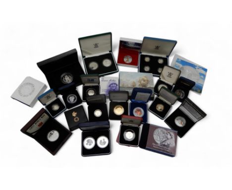 A collection of silver commemorative coins and silver coin sets, cased with COA (24) Condition Report:Available upon request