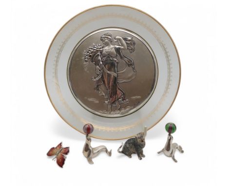 A silver and enamel Saturno cat, with london import marks and JAH, two silver and enamel seals balancing beachballs on their 