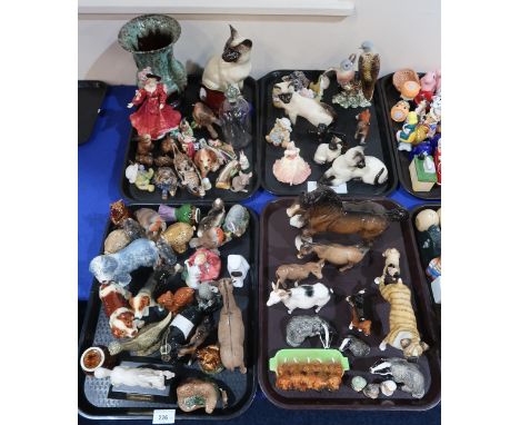 A collection of ceramic animals figures including Beswick Turtle Doves, Badgers, Donkey, Siamese Cats, assorted dogs miniatur