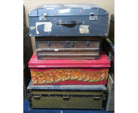 A lot comprising a metal bound travel trunk, metal chest, wood bound travel trunk and a early to mid 20th century cars trunk 