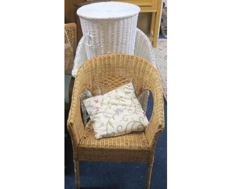 A lot comprising a bergere armchair, two wicker armchairs, wicker laundry hamper and a stool (5) Condition Report:Available u