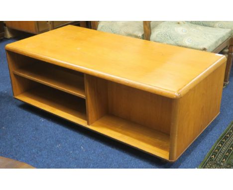 A mid 20th century teak Meredew Avalon coffee table with shaped rectangular top over open record compartment, two narrow draw