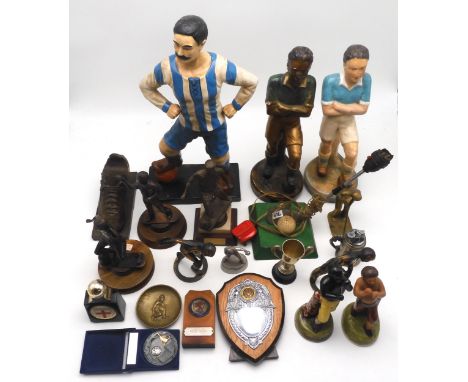 Assorted figures of sportsmen, comprising a large ceramic moustached footballer standing approx. 52cm in height; two smaller 