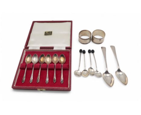 A collection of silver including a set of coffee spoons by Francis Howard, Sheffield, a pair of napkin rings, a set of four m