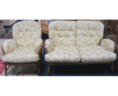 A mid 20th century elm and beech Ercol Windsor suite consisting two seater settee, 81cm high x 140cm wide x 92cm deep and arm
