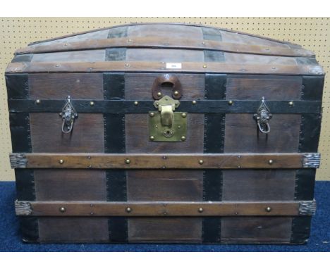 A late 19th/ early 20th century wood bound dome top travel trunk&nbsp; Condition Report:Available upon request