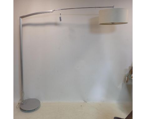 A modern arch lamp, raised on circular base and castors, H.197 W.202cm 