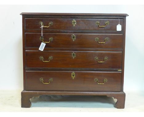 An early 19th century mahogany chest of four graduating drawers, oak lined, raised on bracket feet, H.83 W.90 D.46cm 