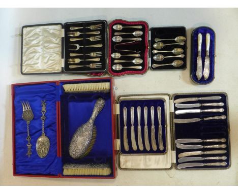 A collection of silver to include cased sets of forks and spoons, a dressing table set and two dutch silver spoon and fork se