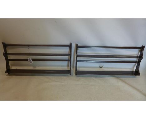 A pair of Ercol mahogany plate racks, H.50 W.98 D.10cm 