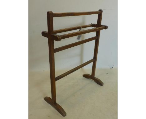 An early to mid 20th century oak towel rail, raised on bracket feet, H.88 W.66 D.20cm 