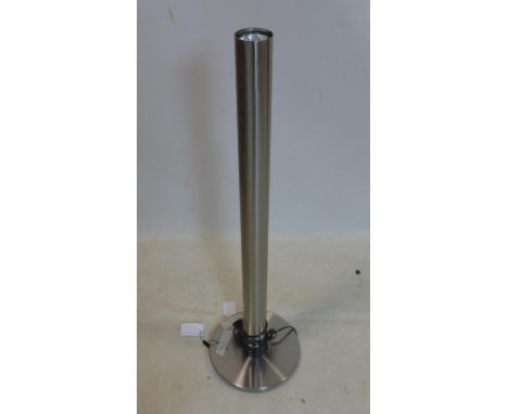 A contemporary tubular standard lamp, on circular base, H.91cm