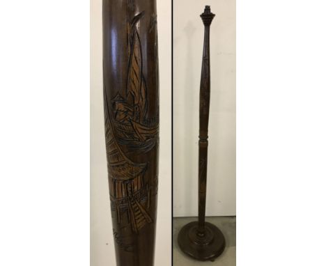 A 1960's lamp standard with Chinese carved decoration of coastal fishing scene.  