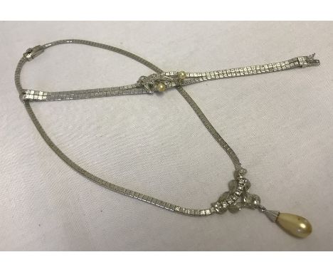 A vintage necklace and matching bracelet set with clear stones and faux pearls. Clasps marked 925. 