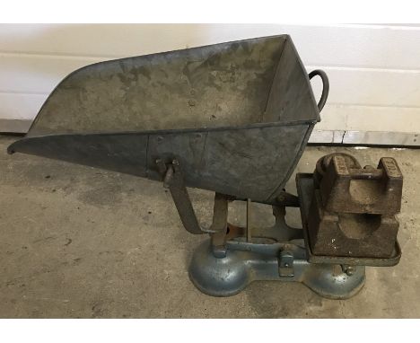 A pair of vintage agricultural weighing scales with galvanised scoop basket. Complete with weights. 