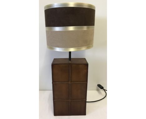 A David Hunt designer table lamp. Ceramic brown leather design with brown & buff suede effect shade. Approx 62cm tall includi