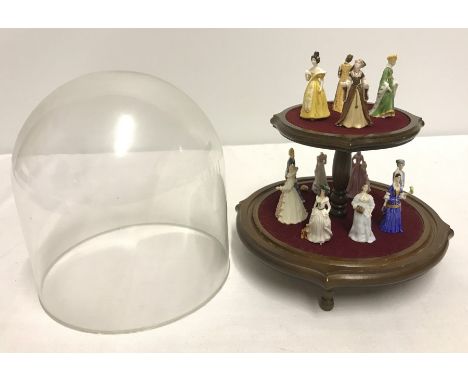 A set of 12 miniature ceramic figurines "The Ladies of Fashion" by Franklin Porcelain (one a/f). Together with a 2 tier displ